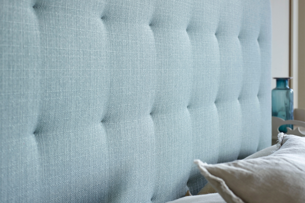 Islay Square Tufted Headboard upholstered in Textured Weave Duck Egg, with subltle pulls, shown in a blue and white floral wallpapered room
