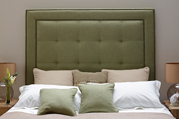 Studded Border Jura Headboard upholstered in Pure New Wool Plain Willow Green, with Vintage Studs and Self Buttoning in a Farrow & Ball Painted Room