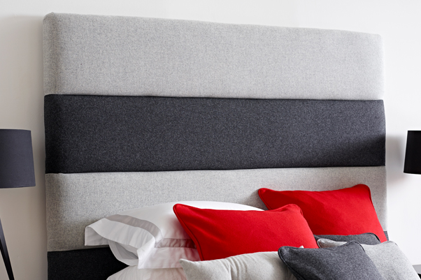 Contemporary Monochrome Panelled Orkney Headboard upholstered in Wool Plain Mid & Dark Grey in a Farrow & Ball All White painted room