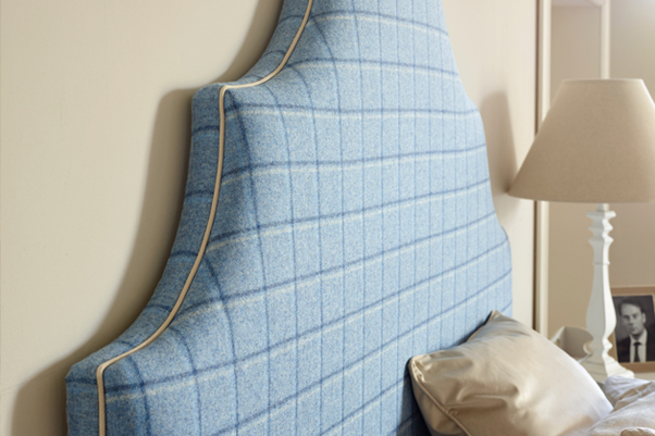 Ornate Curved Shape Samson Headboard upholstered in Pure Wool Check Wedgwood Blue, with Contrast Piping in Pure Cotton Natural in a Farrow and Ball painted room