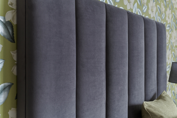 Contemporary Fluted Taransay Headboard upholstered in Flat Velvet Storm in a Jardin Des Plantes Floral Green wallpapered room