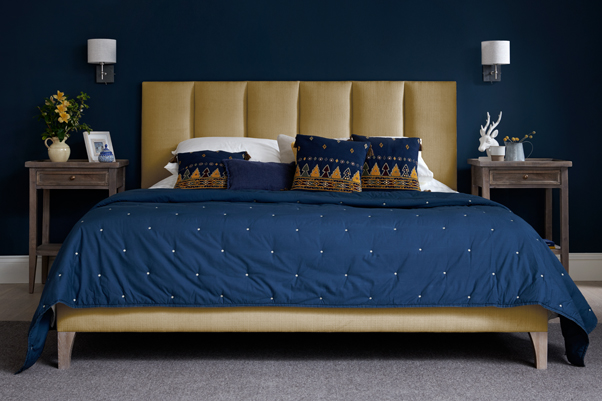 Fluted Contemporary Taransay Grand Bed upholstered in House Chenille Mustard in a Farrow and Ball Hague Blue painted room