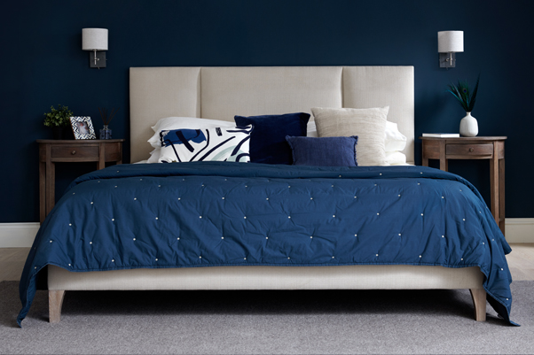 Panelled Contemporary Tiree Grand Bed upholstered in House Chenille Stone in a Farrow and Ball Hague Blue painted room